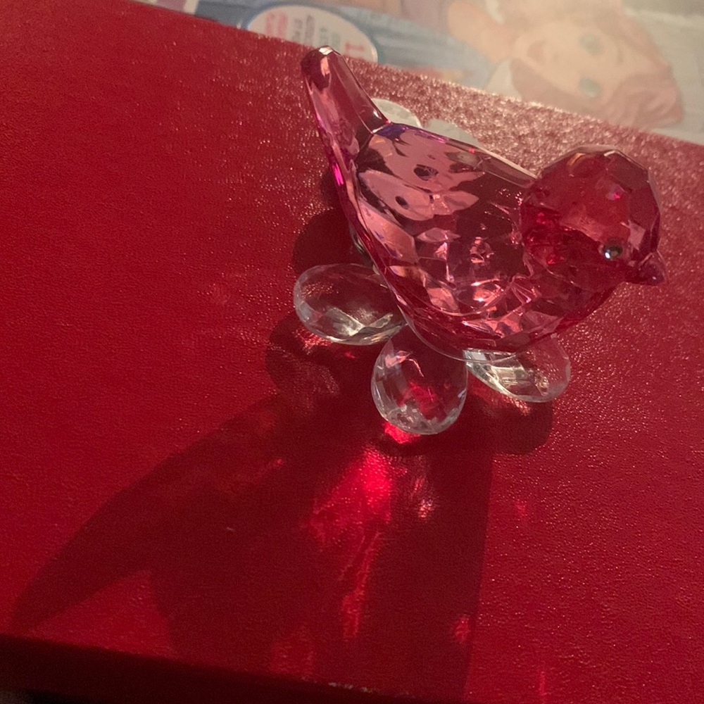A translucent pink bird ornament